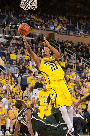 Zak Irvin (21) and Muhammad-Ali Abdur-Rahkman (12)