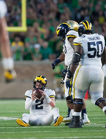 Shea Patterson (2), Juwann Bushell-Beatty (76), and Michael Onwenu (50)