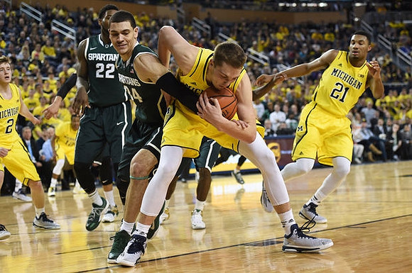 Spike Albrecht (2), Mark Donnal (34), and Zak Irvin (21)