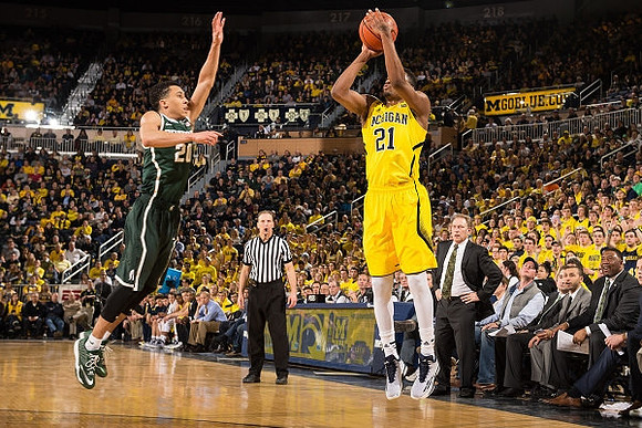 Zak Irvin (21) and Michigan State Head Coach Tom Izzo