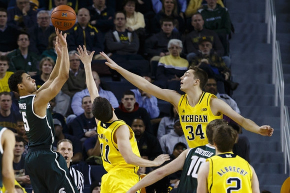 Andrew Dakich (11), Mark Donnal (34), and Spike Albrecht (2)
