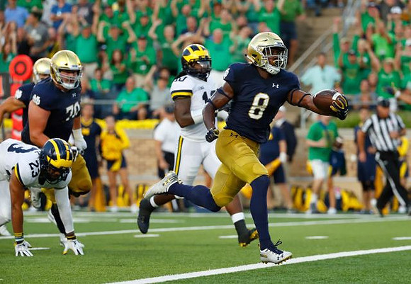 Tyree Kinnel (23) and Devin Bush (10)