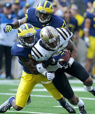 Carvin Johnson (13) and Brandon Herron (58)