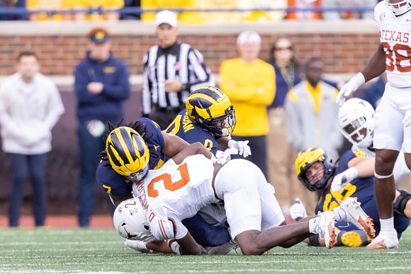 Donovan Edwards (7), Semaj Morgan (0), and Josh Priebe (68)
