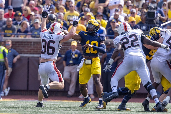 Alex Orji (10) and Dominick Giudice (56)