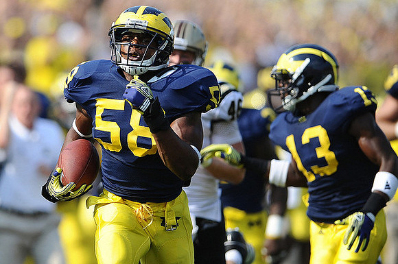 Brandon Herron (58) and Carvin Johnson (13)