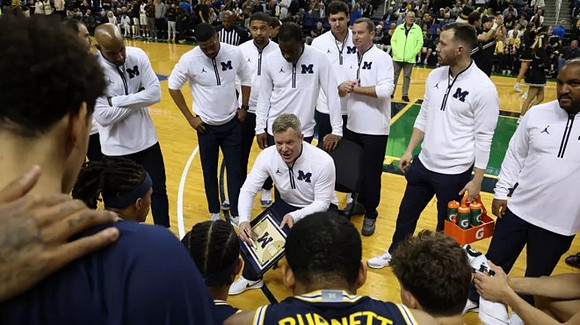 Wake Forest Head Coach Steve Forbes and Michigan Team