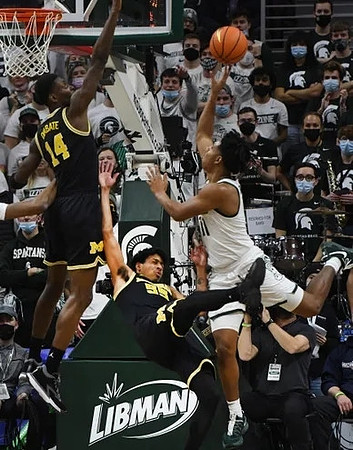 Moussa Diabate (14) and Eli Brooks (55)