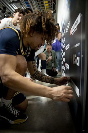 Tre Donaldson (3) and Michigan Team