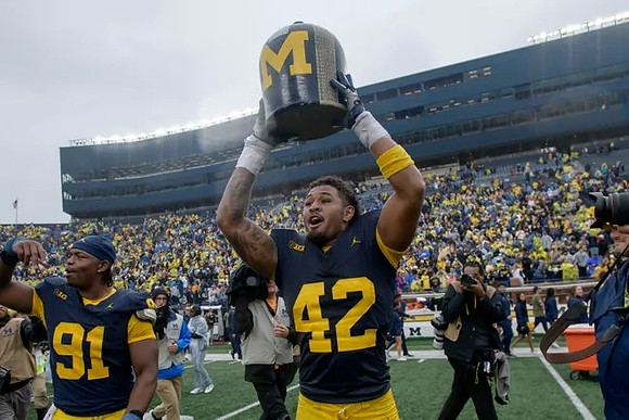 Cameron Brandt (91), TJ Guy (42), and The Little Brown Jug