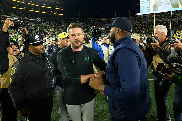 Oregon Head Coach Dan Lanning and Sherrone Moore