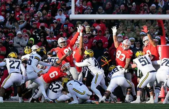 Dominic Zvada (96), Tommy Doman (19), and Michigan Team