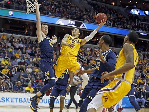 Duncan Robinson (22), Derrick Walton Jr. (10), and Muhammad-Ali Abdur-Rahkman (12)