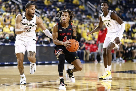 DeVante' Jones (12) and Moussa Diabate (14)