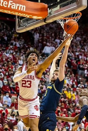 Hunter Dickinson (1) and Moussa Diabate (14)