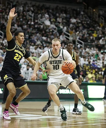 Caleb Houstan (22) and Moussa Diabate (14)