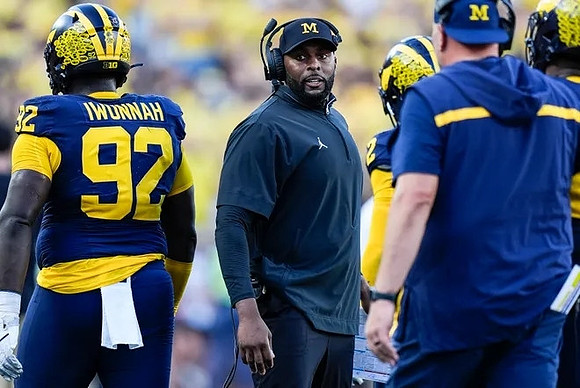 Ike Iwunnah (92) and Sherrone Moore