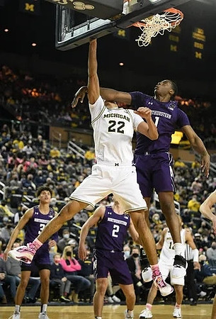 Caleb Houstan (22) and DeVante' Jones (12)
