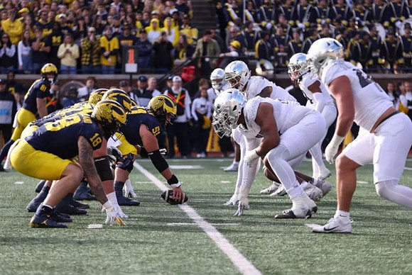 Greg Crippen (51), Colston Loveland (18), and Peyton O'Leary (81)