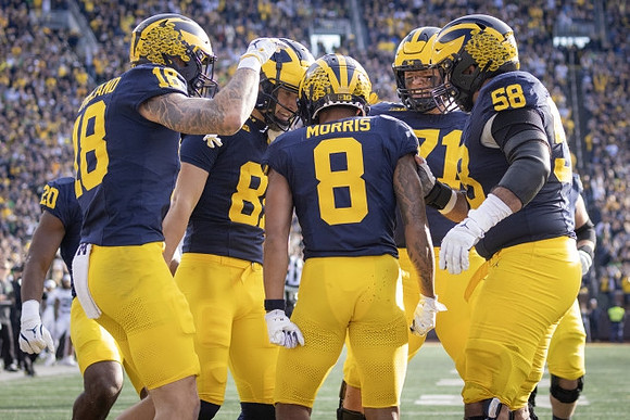 Kalel Mullings (20), Colston Loveland (18), Tyler Morris (8), Evan Link (71), and Giovanni El-Hadi (58)