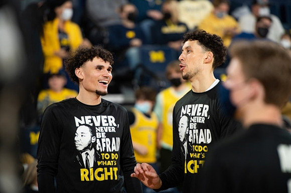 Adrien Nunez (0) and Brandon Johns Jr. (23)