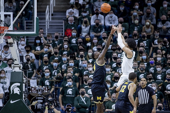 Moussa Diabate (14) and DeVante' Jones (12)