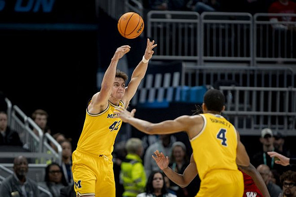 Will Tschetter (42) and Nimari Burnett (4)