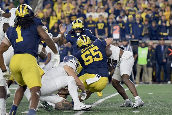 Jaishawn Barham (1), Mason Graham (55), and Makari Paige (7)