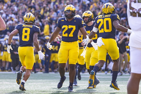 Tyler Morris (8), Tyler McLaurin (27), and Kalel Mullings (20)