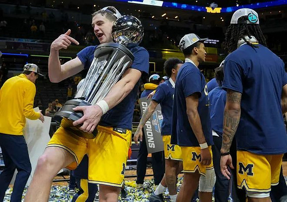 Will Tschetter (42), Michigan Team, and Big Ten Tournament Championship Trophy