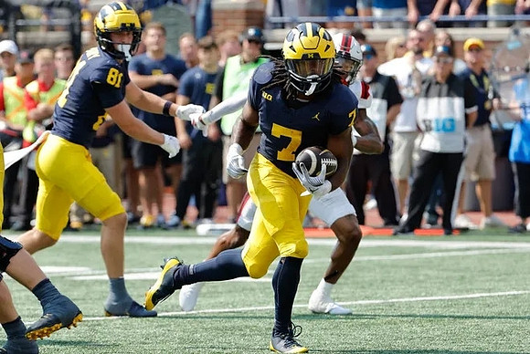 Peyton O'Leary (81) and Donovan Edwards (7)