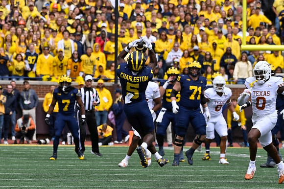 Donovan Edwards (7), C.J. Charleston (5), and Evan Link (71)