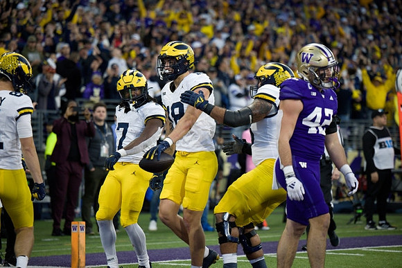 Peyton O'Leary (81), Donovan Edwards (7), and Colston Loveland (18)