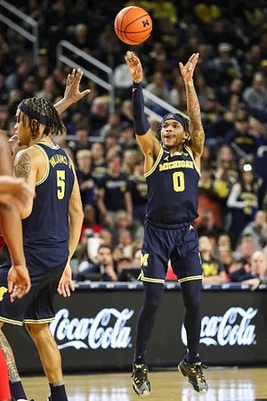 Terrance Williams II (5) and Dug McDaniel (0)