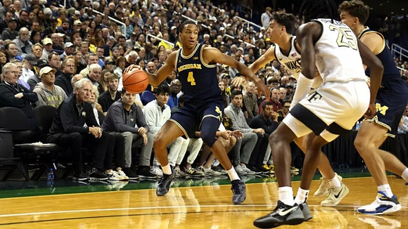 Nimari Burnett (4) and Will Tschetter (42)