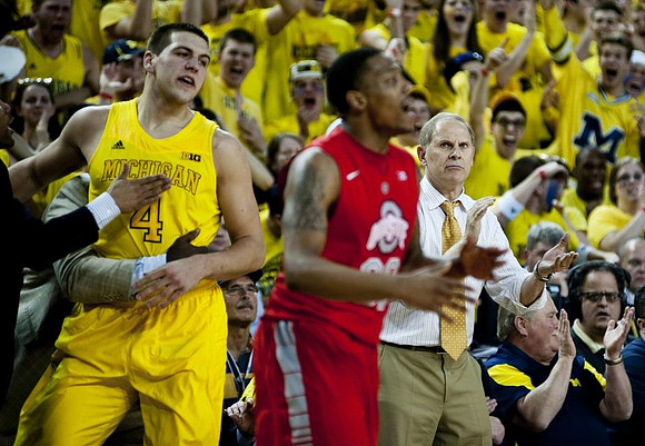 Mitch McGary (4) and John Beilein