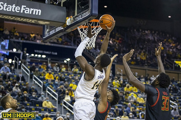 DeVante' Jones (12) and Moussa Diabate (14)