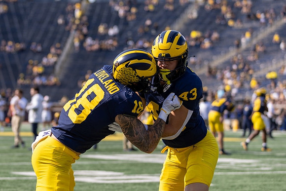 Colston Loveland (18) and Deakon Tonielli (43)