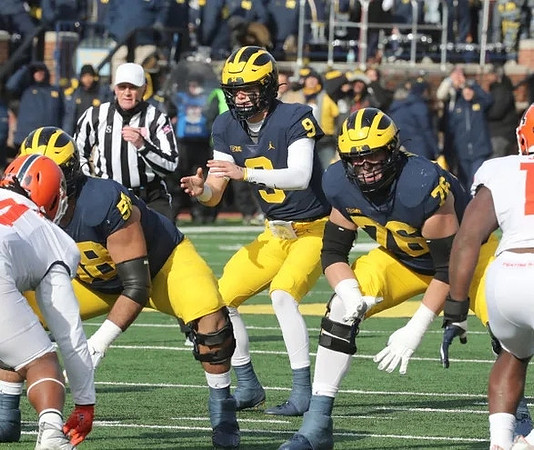 Giovanni El-Hadi (58), J.J. McCarthy (9), and Ryan Hayes (76)