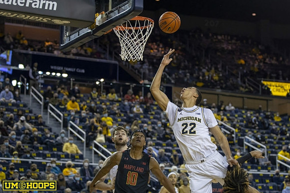 Hunter Dickinson (1), Caleb Houstan (22), and Terrance Williams II (5)
