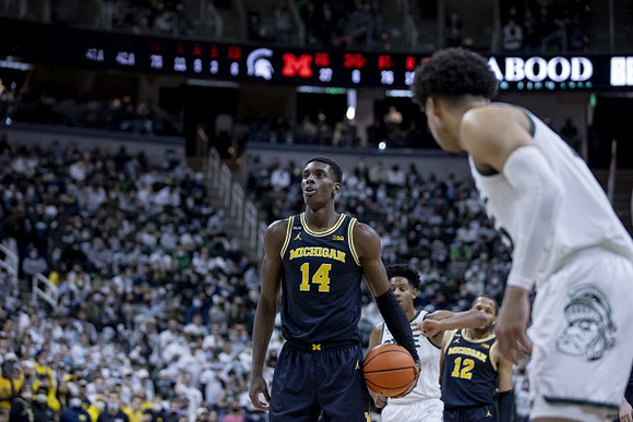 Moussa Diabate (14) and DeVante' Jones (12)