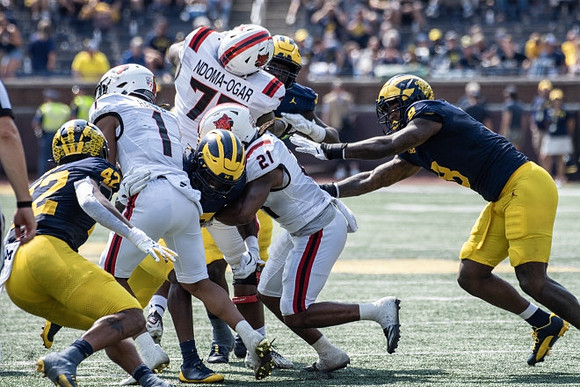 TJ Guy (42) and Derrick Moore (8)