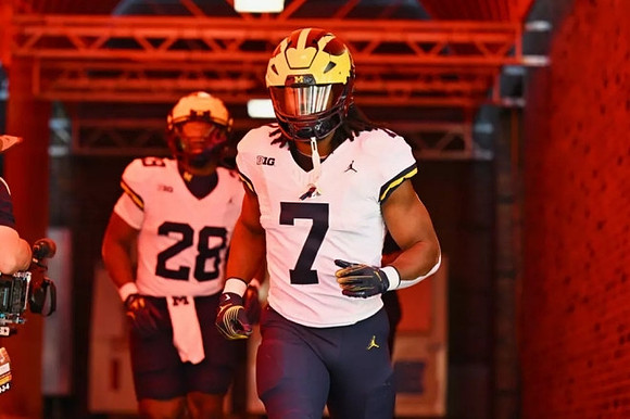Benjamin Hall (28) and Donovan Edwards (7)