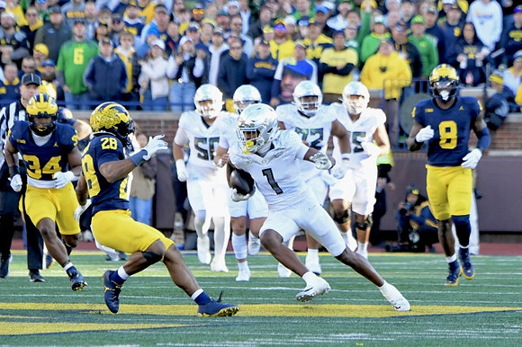 Jaydon Hood (34), Quinten Johnson (28), and Derrick Moore (8)