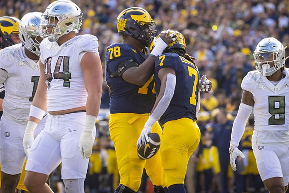 Myles Hinton (78) and Donovan Edwards (7)