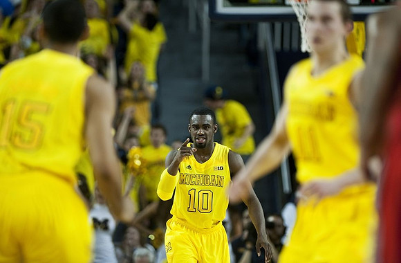Jon Horford (15), Tim Hardaway Jr. (10), and Nik Stauskas (11)