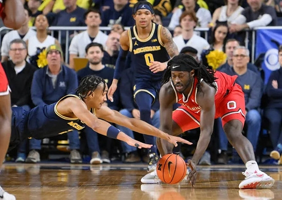 Kobe Bufkin (2) and Dug McDaniel (0)