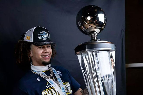Tre Donaldson (3) and Big Ten Tournament Championship Trophy