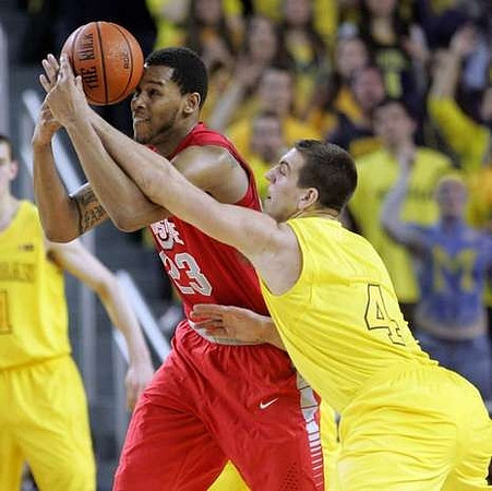 Nik Stauskas (11) and Mitch McGary (4)