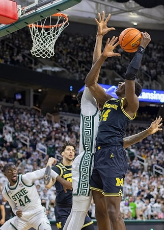 Brandon Johns Jr. (23) and Moussa Diabate (14)